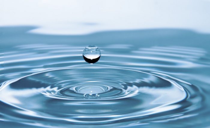 Beautiful background of water drop falling on water Beautiful background of water drop falling on water